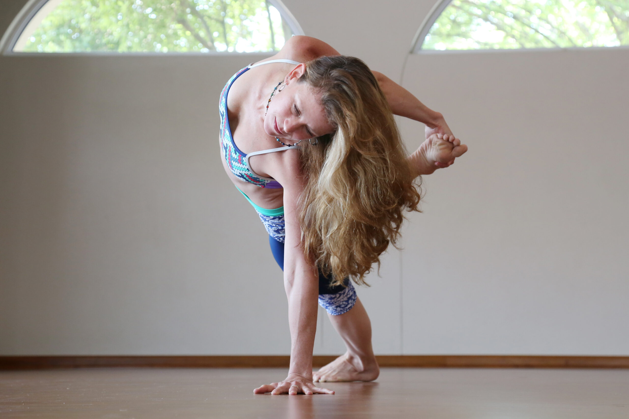 Kerry Weavind in a standing twist at her yoga studio in Fourways